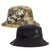 A reversible bucket hat, one side Desolve camouflage and one black, with 'Hunters Element' branding.